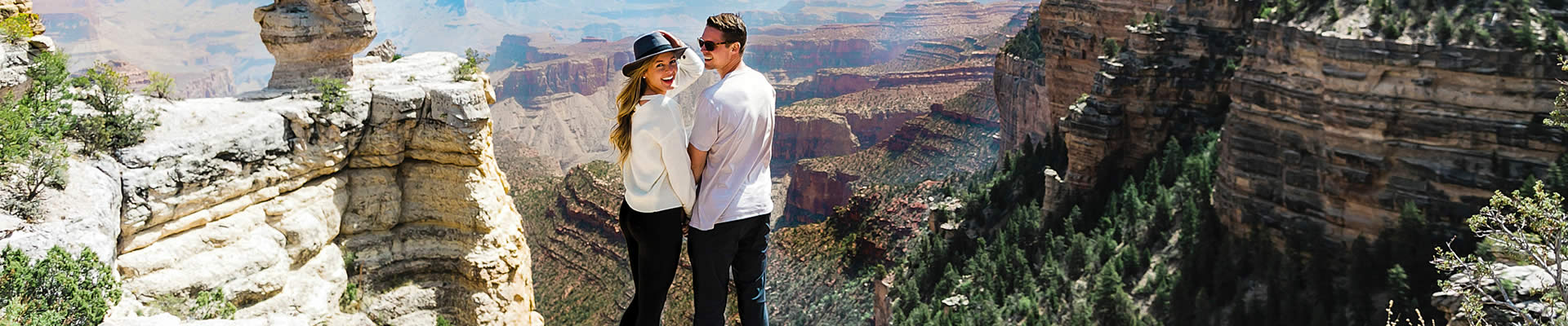 Couple looking over the edge of the Grand Canyon's South Rim